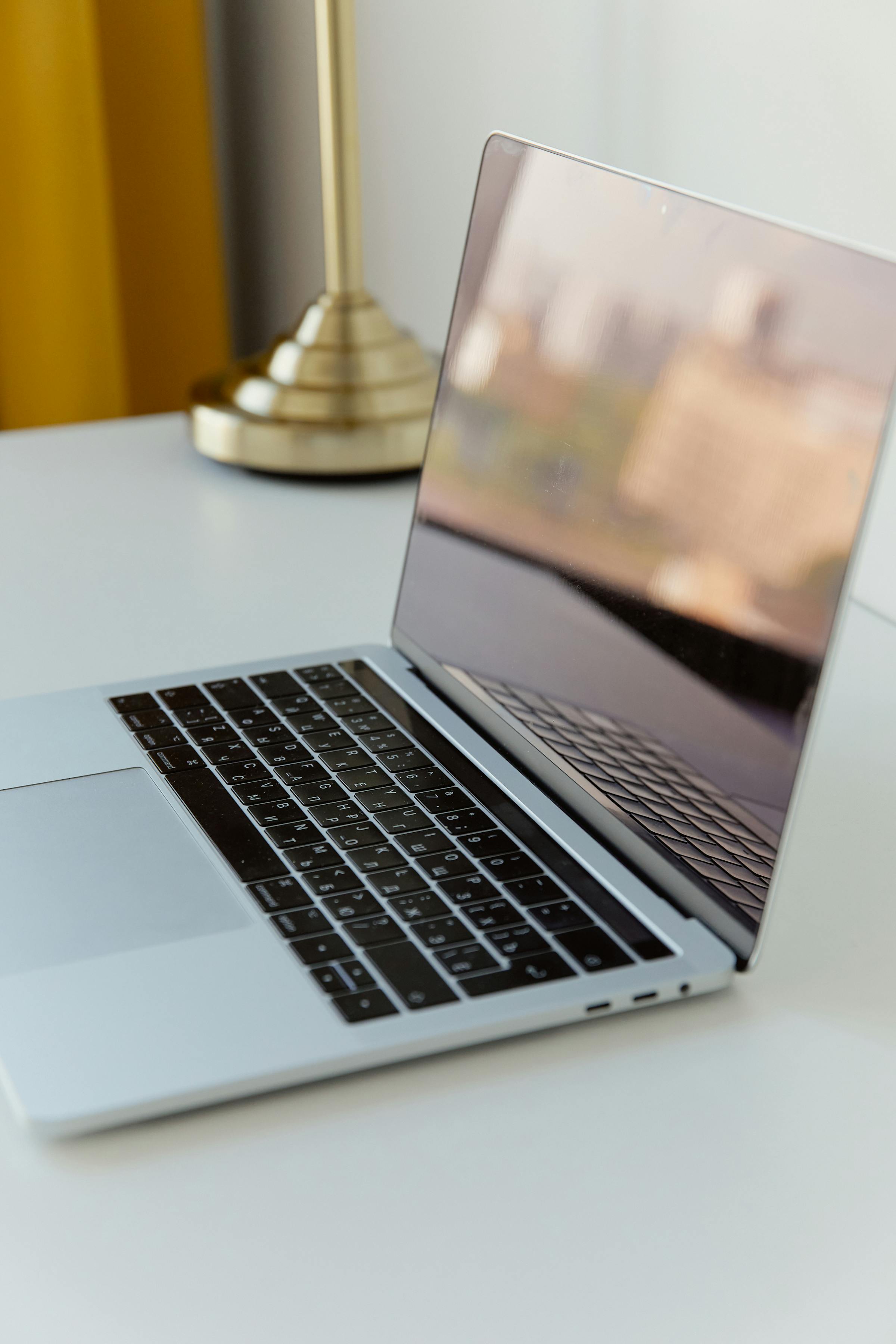 Laptop on a clean desk in soft natural light